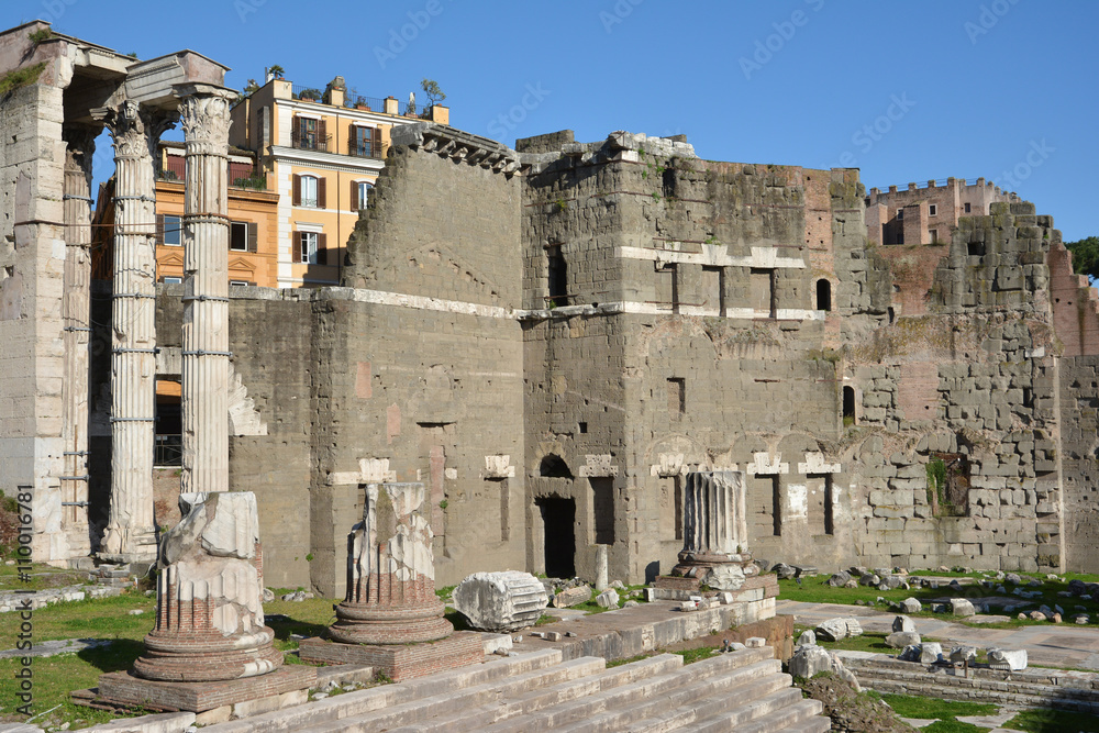 Ruins of Temple of Mars Ultor in Forum of Augustus with protecting wall made by peperino stone blocks in opus quadratum style