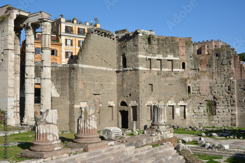 Ruins of Temple of Mars Ultor in Forum of Augustus with protecting wall made by peperino stone blocks in opus quadratum style photo