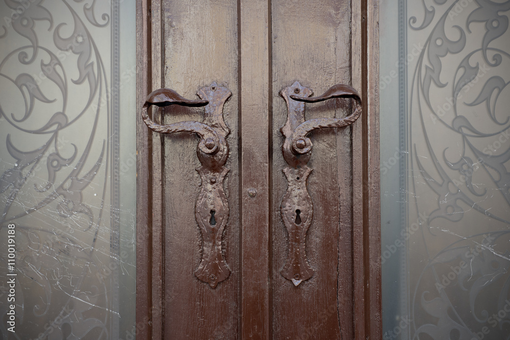 Old doors, handles, locks, lattices and windows. Double door with beautiful stained glass. Old doors, handles, locks, lattices and windows. Double door with beautiful stained glass.
