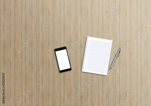 Office desk top view mock up image with smartphone, notebook and pen. Wooden background