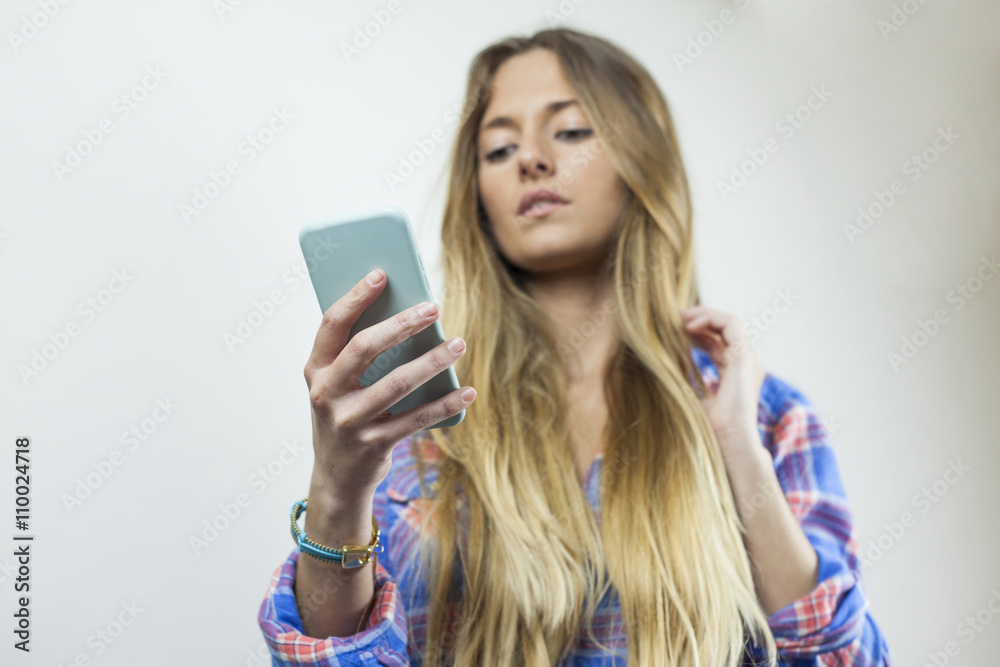 Close up portrait of beautiful blonde woman with plaid shirt sen Close up portrait of beautiful blonde woman with plaid shirt sen