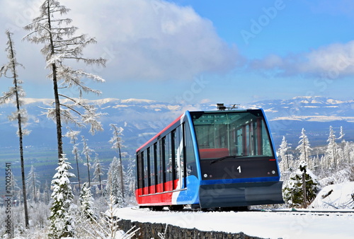 Cableway cabin on rails in mountains