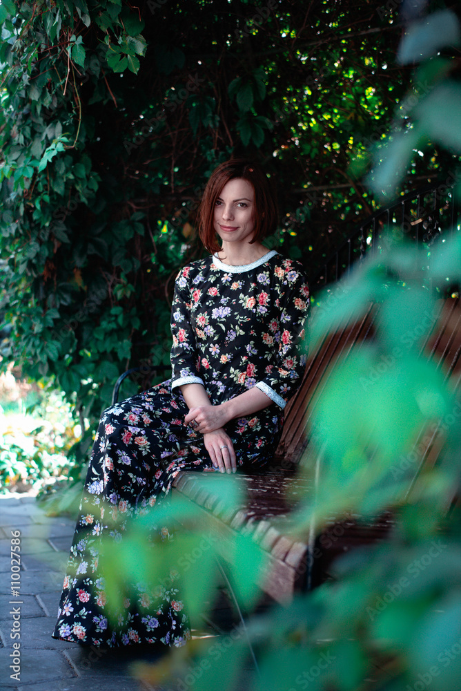 young woman, against background of summer green park, leaves young woman, against background of summer green park, leaves