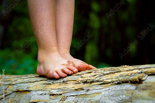 Dirty Feet Balancing On A Log