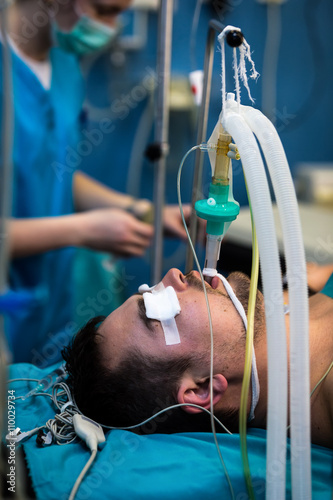 Young male patient with endotracheal intubation.