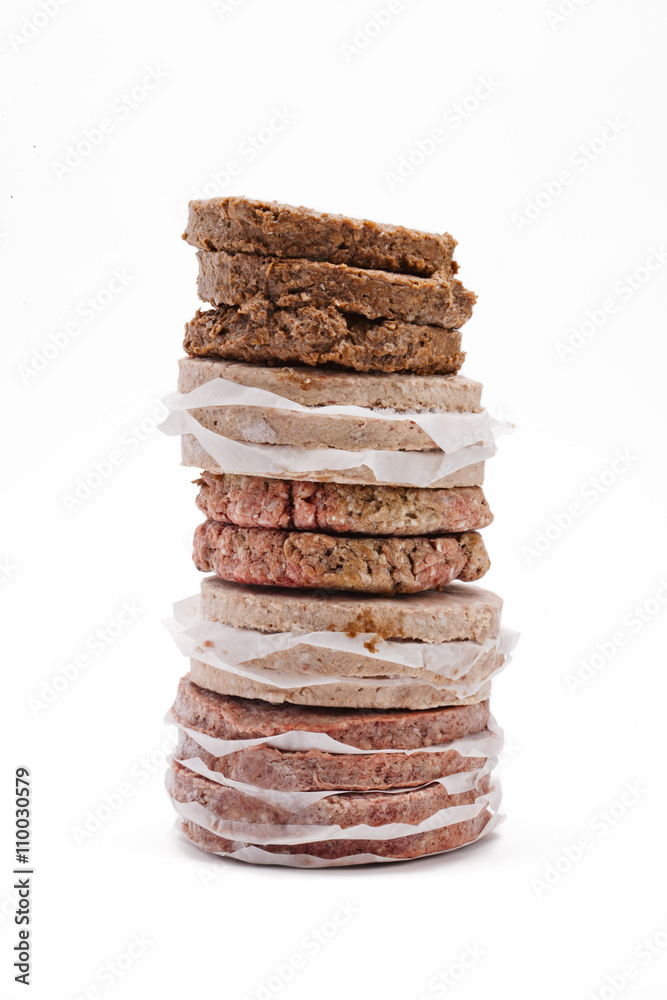 minced meat arranged on top of each other over plain white background. minced meat arranged on top of each other over plain white background.