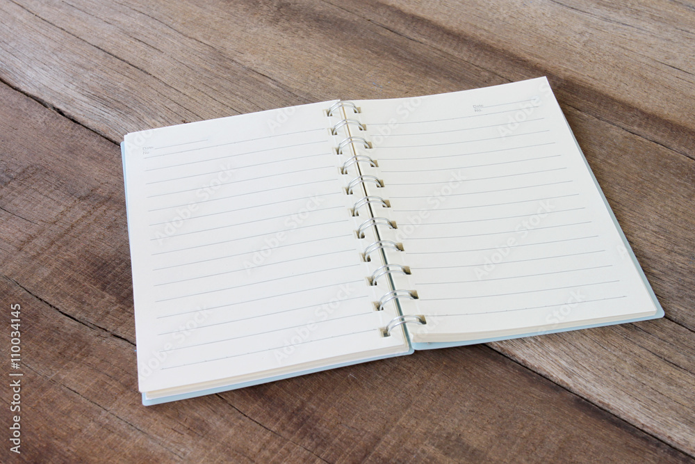 Empty book is placed on old wooden floor. Empty book is placed on old wooden floor.