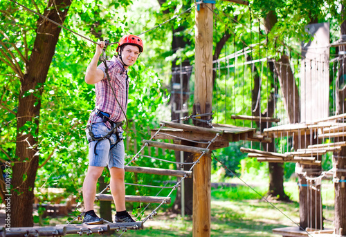 adventure climbing high wire park - people on course in mountain © davit85