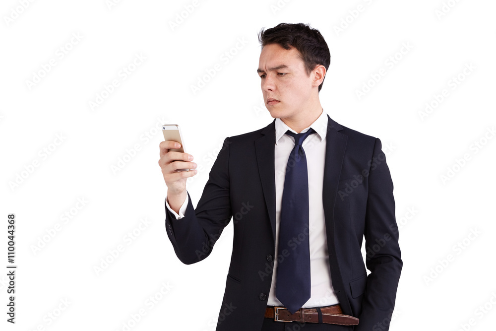 Young Caucasian business man looking at mobile phone Young Caucasian business man looking at mobile phone