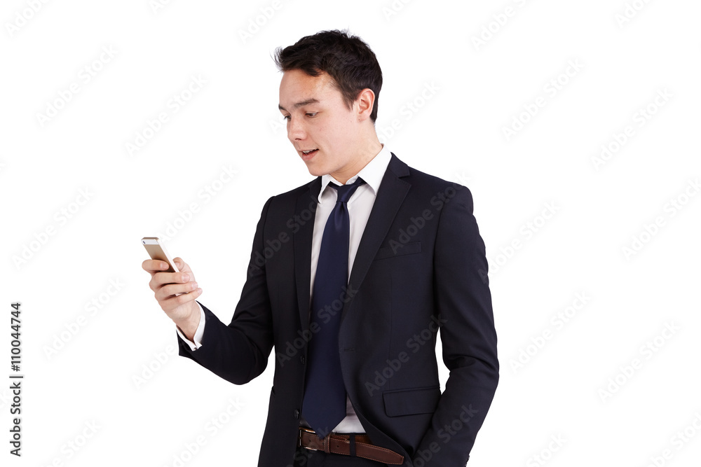 Young Caucasian business man looking at mobile phone smiling Young Caucasian business man looking at mobile phone smiling