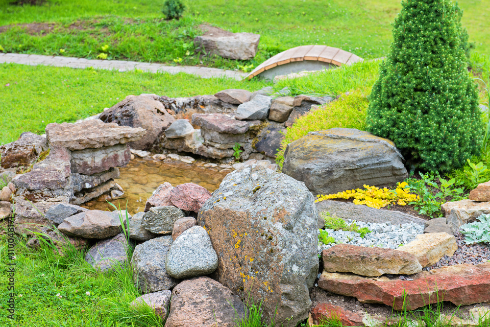 Alpine garden with green grass Alpine garden with green grass