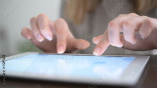 Hand touching screen on modern digital tablet pc.