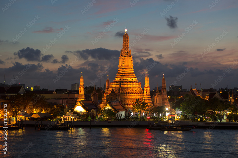 River and Wat Arun Temple at night in Bangkok Thailand