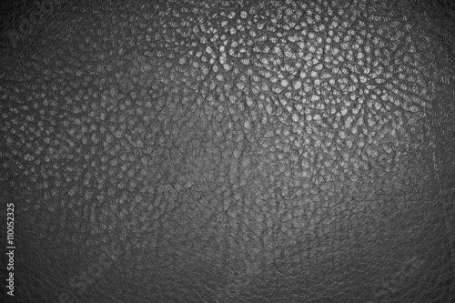 Black leather material texture background close up 