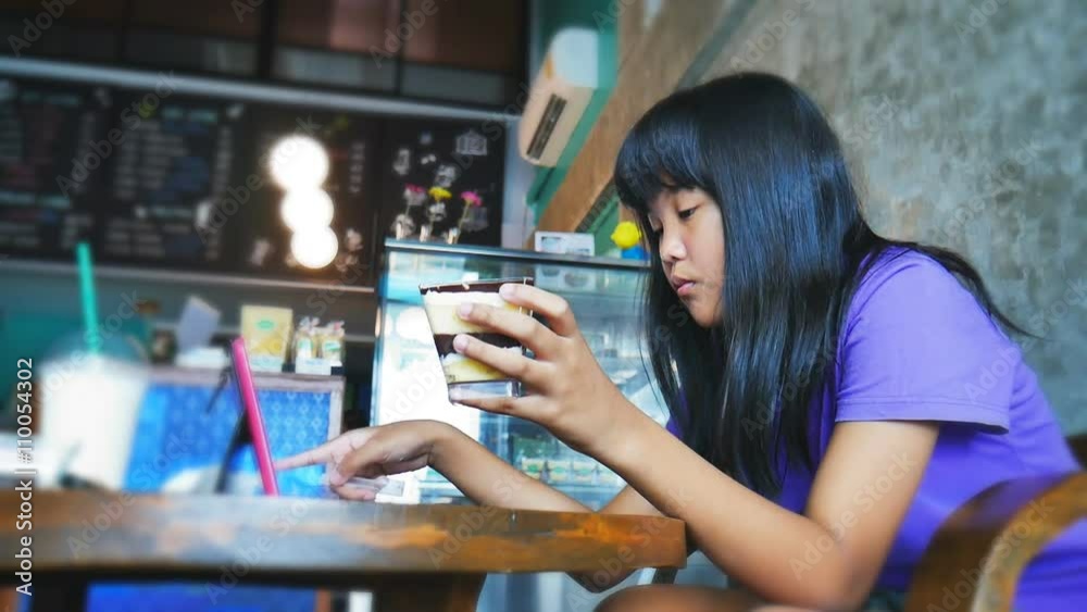 Young asian lady to relaxing in food shop Young asian lady to relaxing in food shop