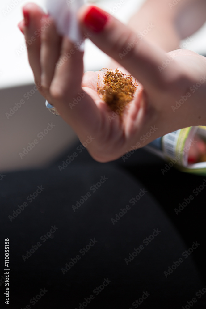 Tobacco in woman hand Tobacco in woman hand