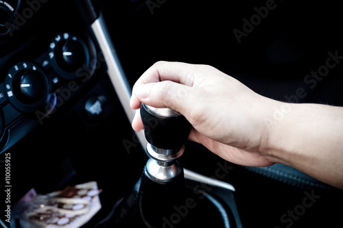 Hand changing a car transmission