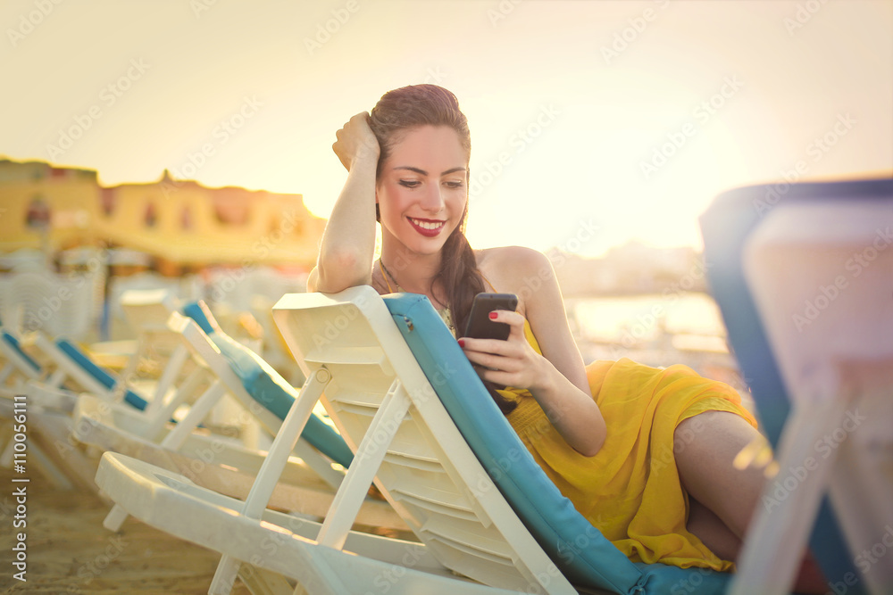 Girl sitting at the beach