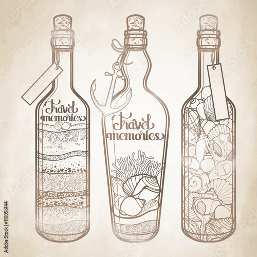 Sand and seashells in bottles.  