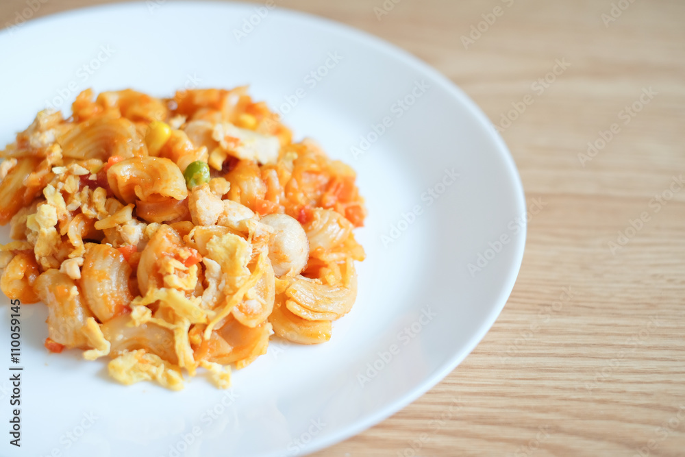macaroni pasta in tomato sauce on a wooden table macaroni pasta in tomato sauce on a wooden table