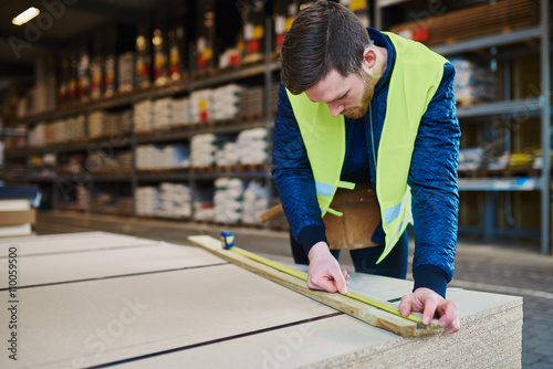 Fotografie Handyman working in warehouse