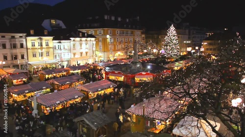 Christmas market in Bolzano in Walther Square with lights and decorations photo