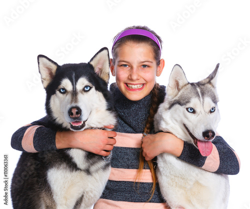 Girl is with her dogs husky