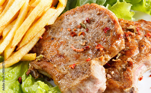 Juicy roasted pork steak wi...