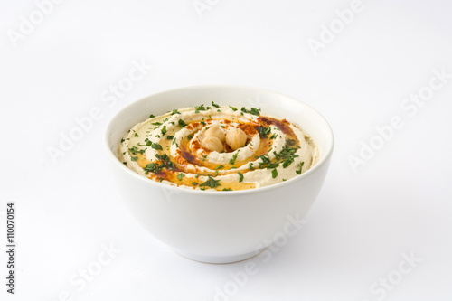 Hummus in bowl isolated on white background