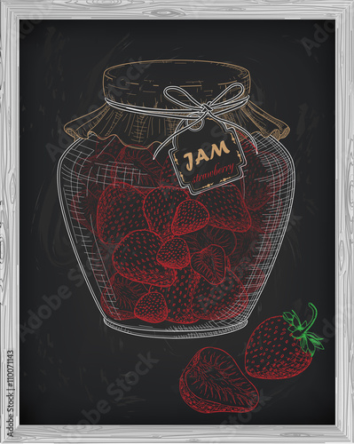 beautiful jar of homemade jam with strawberry on a black backgro