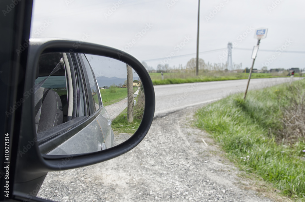 Country road seen from the mirror