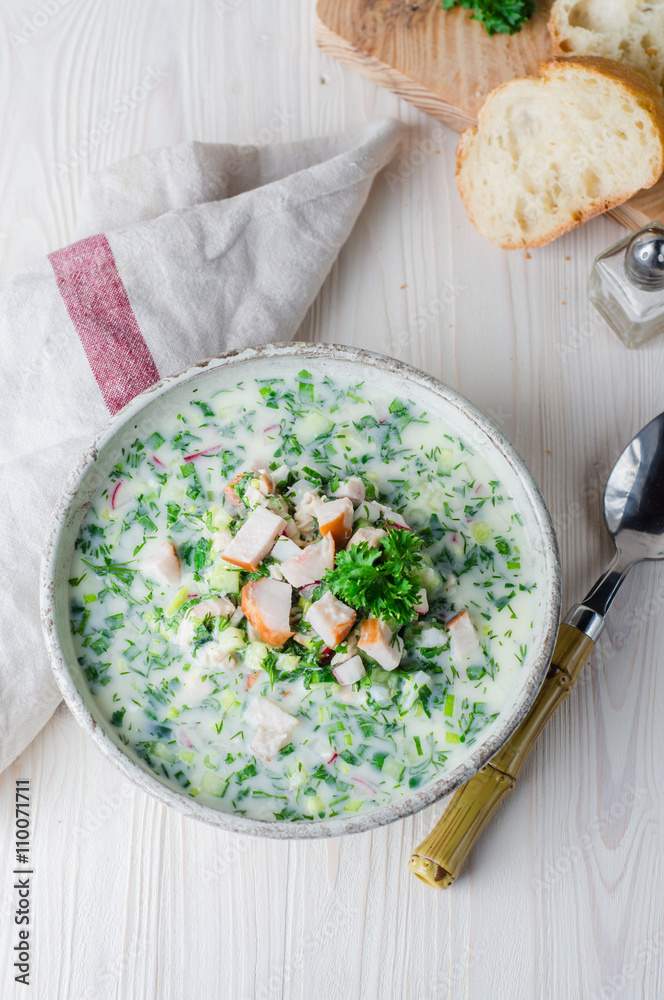 Okroshka with smoked chicken breast - Russian cold soup with vegetables on white wooden background. Selective focus Okroshka with smoked chicken breast - Russian cold soup with vegetables on white wooden background. Selective focus