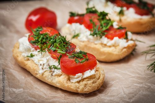 Delicious bruschetta with tomatoes, feta cheese, dill and spice © Arkadiusz Fajer