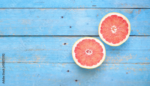 grapefruit, on rustic table, flat lay, good copy space photo