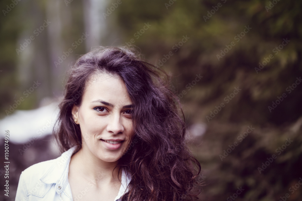 Closeup of a beautiful hispanic woman outdoor near a pine forest Closeup of a beautiful hispanic woman outdoor near a pine forest