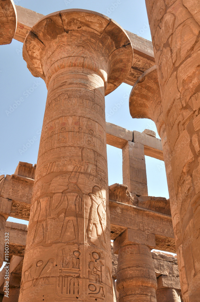 Columns painted in the Ancient temple Karnak in Luxor. Egypt.