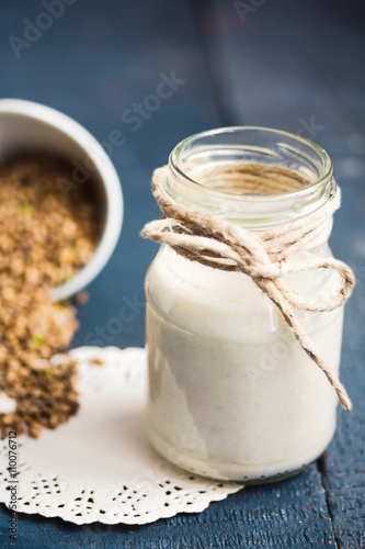 vegan fresh milk from hemp seeds in a glass jar, clean eating