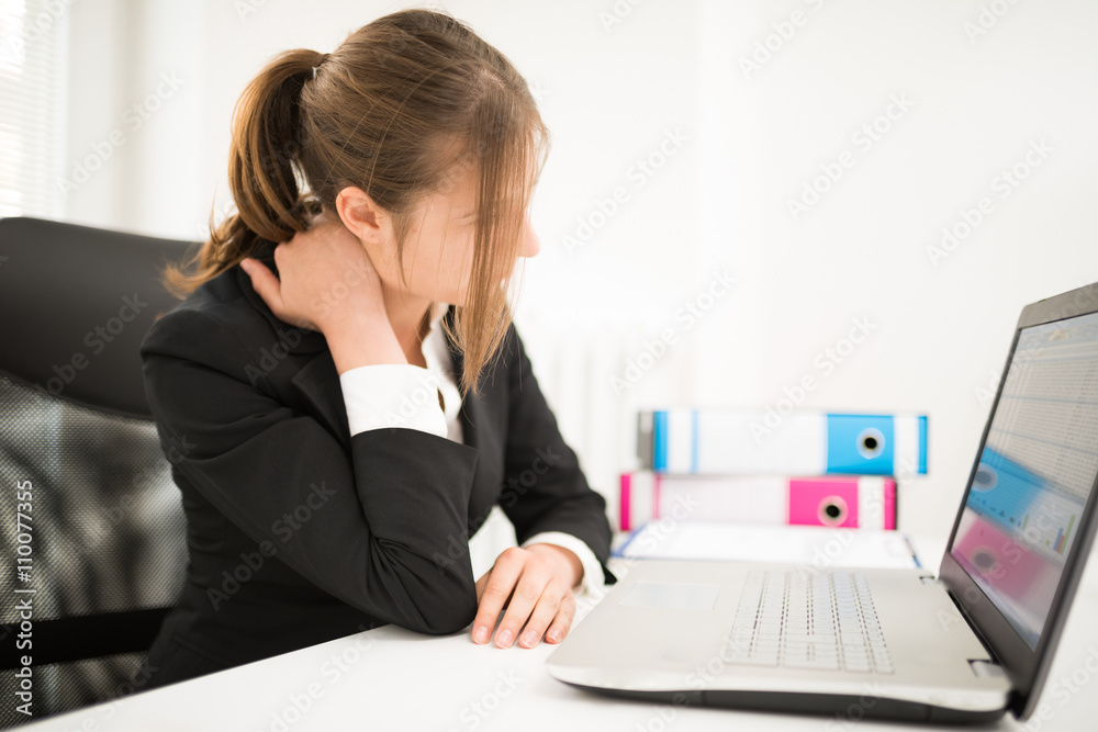 Woman suffering neck pain from bad posture Woman suffering neck pain from bad posture