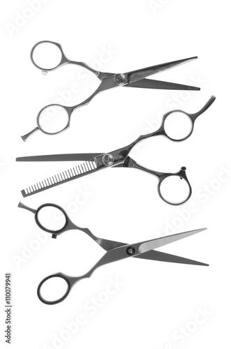 Hairdressing scissors on a white background close-up