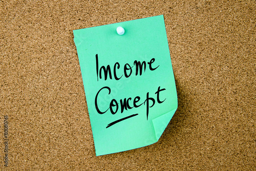 Income Concept written on green paper note