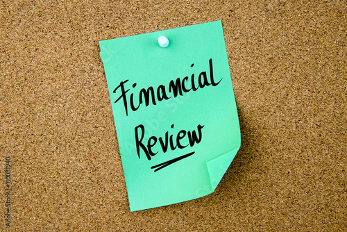 Financial Review written on green paper note