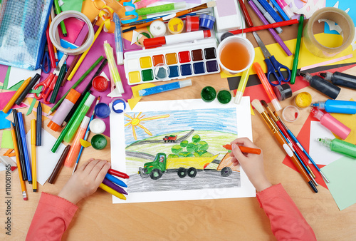 harvesting, truck with vegetables goes off field, dog driver, agriculture concept, child drawing, top view hands with pencil painting picture on paper, artwork workplace