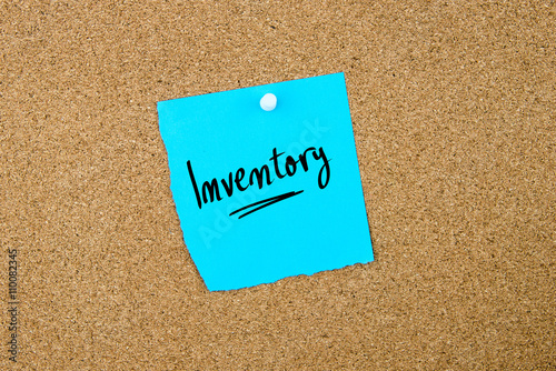 Inventory written on blue paper note