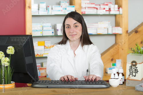 Apotheke PTA  in moderner Apotheke mit Holz photo