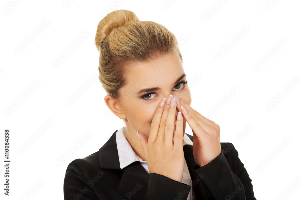 Businesswoman giggles covering her mouth with hand Businesswoman giggles covering her mouth with hand