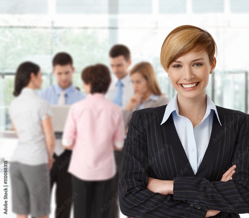 Portrait if happy businesswoman with colleagues Portrait if happy businesswoman with colleagues