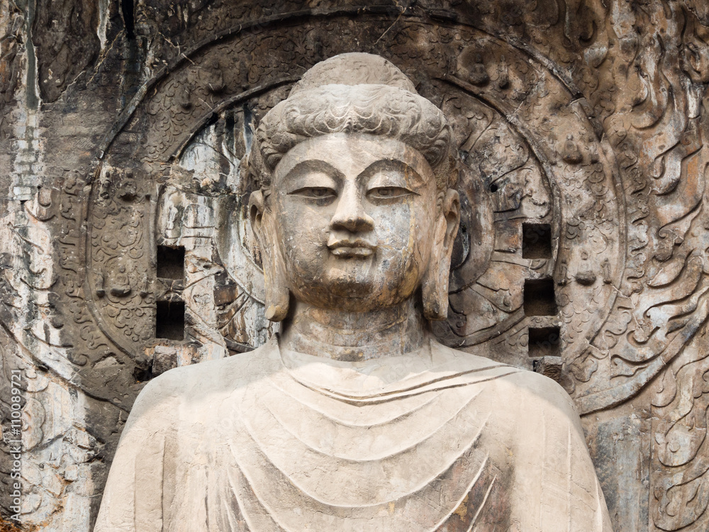 Stone buddhist statue in Longmen Grottoes, China Stone buddhist statue in Longmen Grottoes, China
