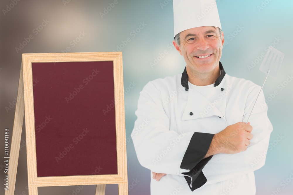 Composite image of a cook holding utensil Composite image of a cook holding utensil