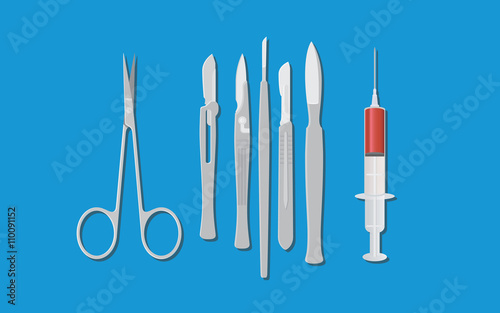 surgery surgeon metal tools with knife scissors and syringe