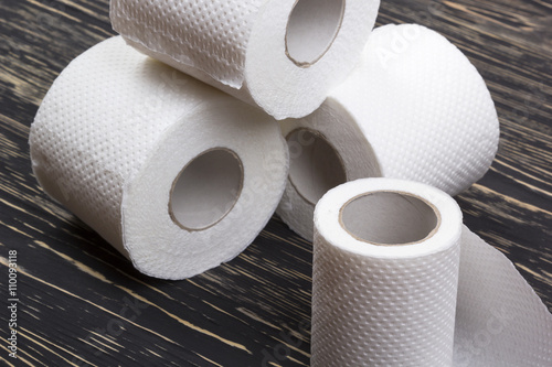 Toilet paper on wooden board